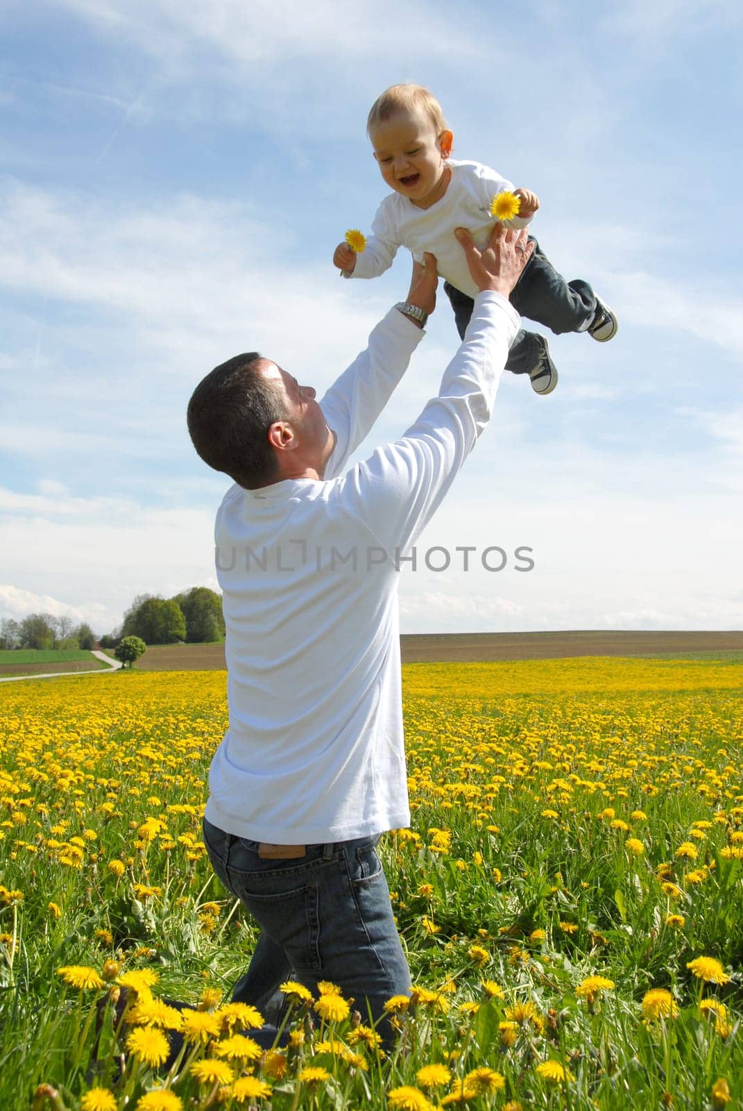 Proud Father - Holding Up Child -