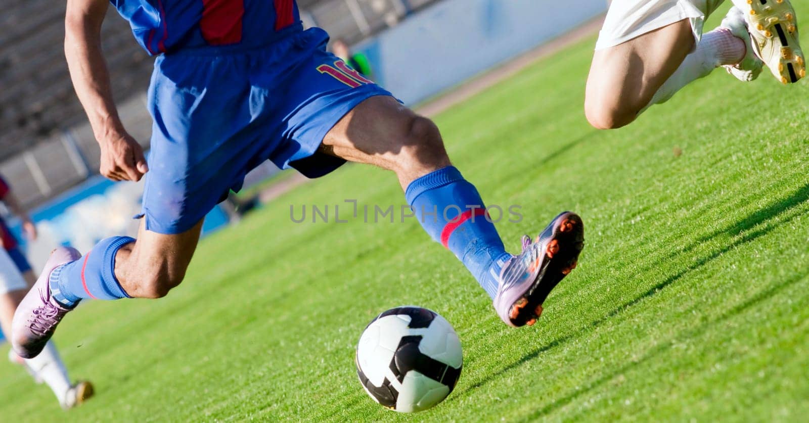 Soccer players fighting for the ball