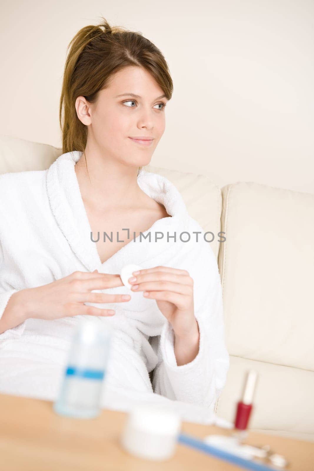 Body care - woman remove nail polish
