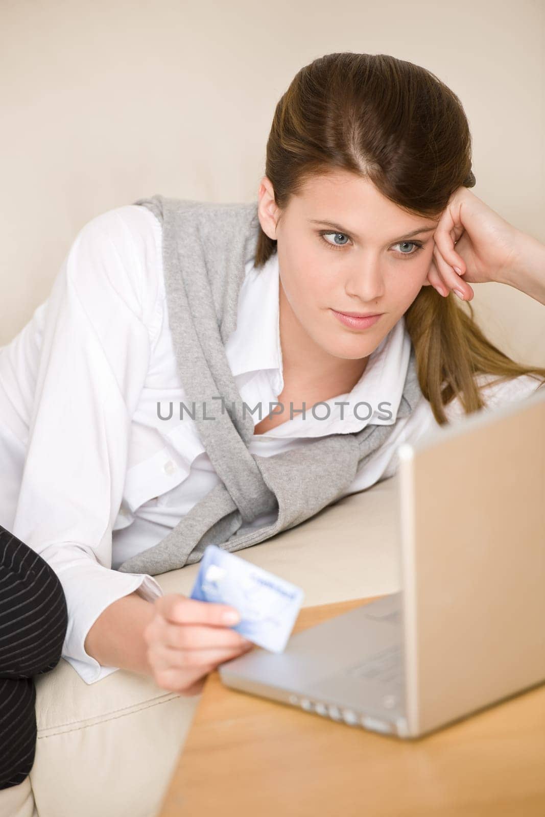 Home shopping - woman with credit card and laptop