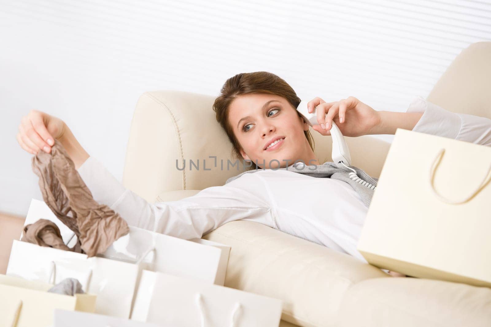Young business woman with shopping bag