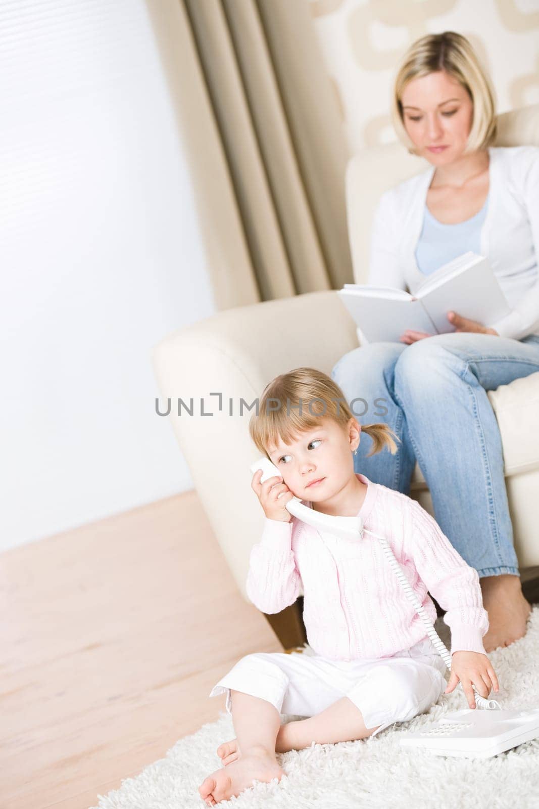 Mother and child-on the phone in lounge