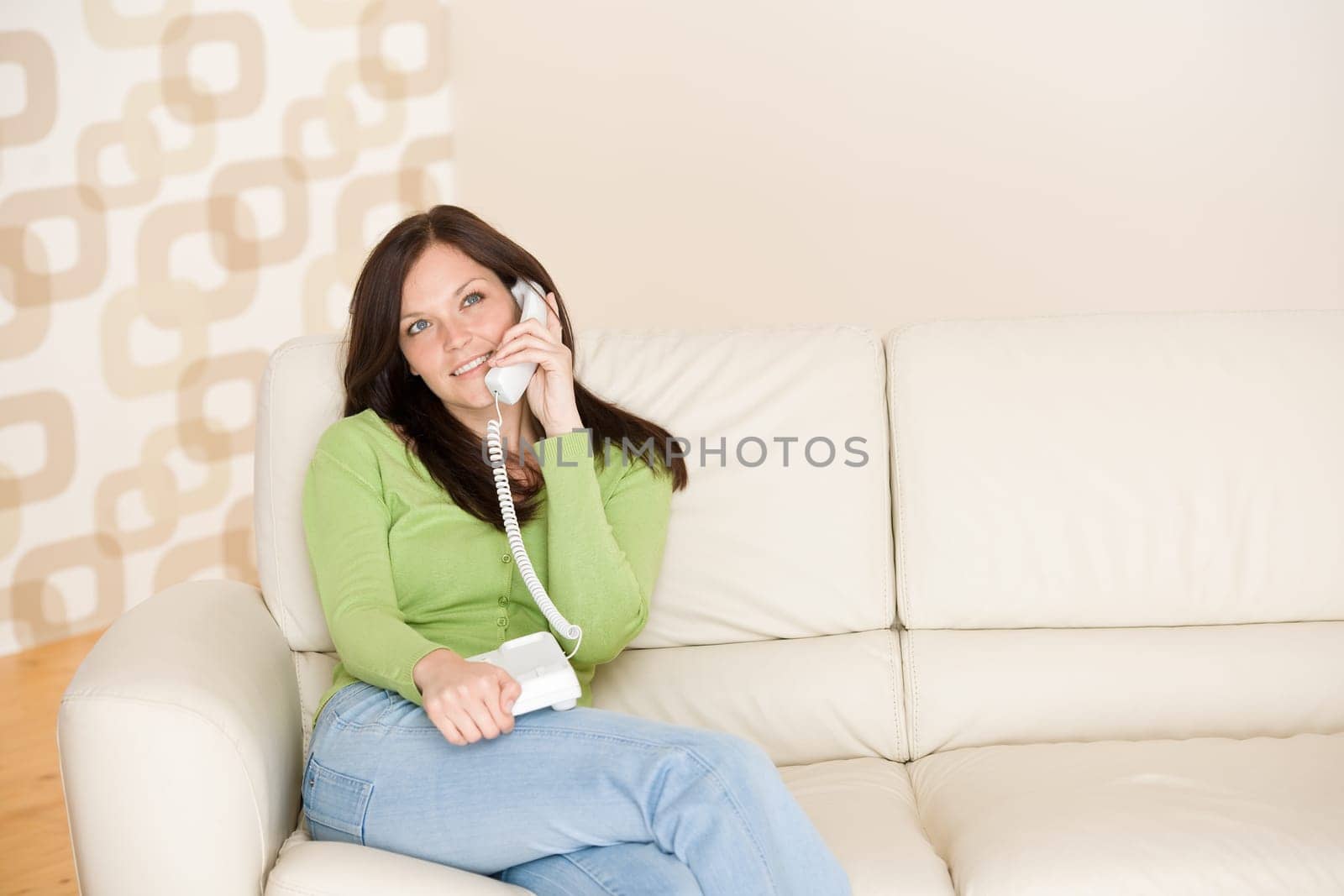 On the phone home Smiling woman calling