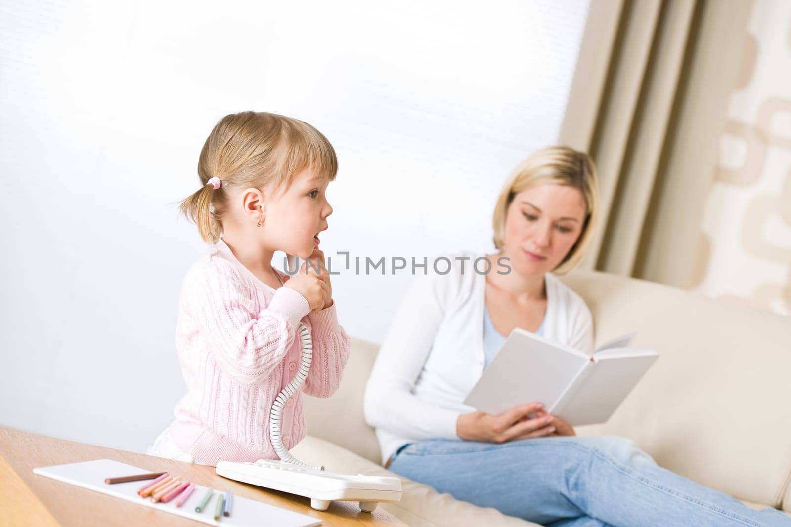 Mother and child-on the phone in lounge