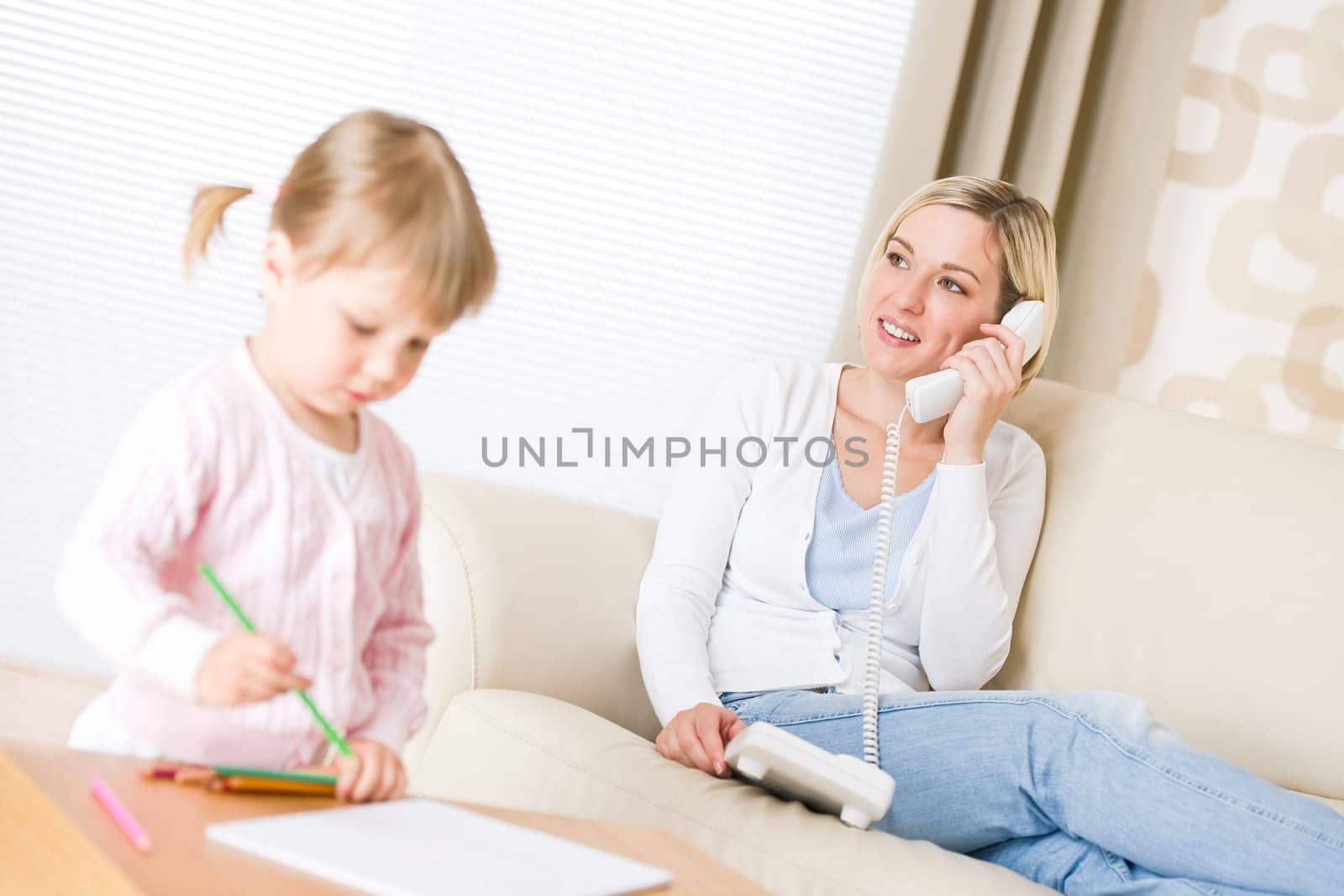 Little girl draw with color pencil in lounge