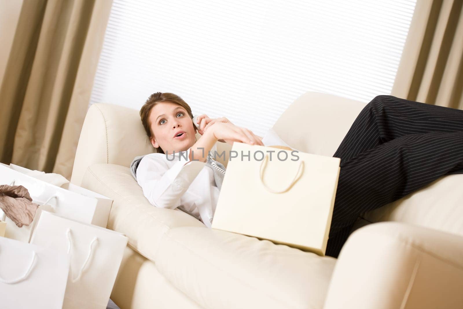 Young business woman with shopping bag