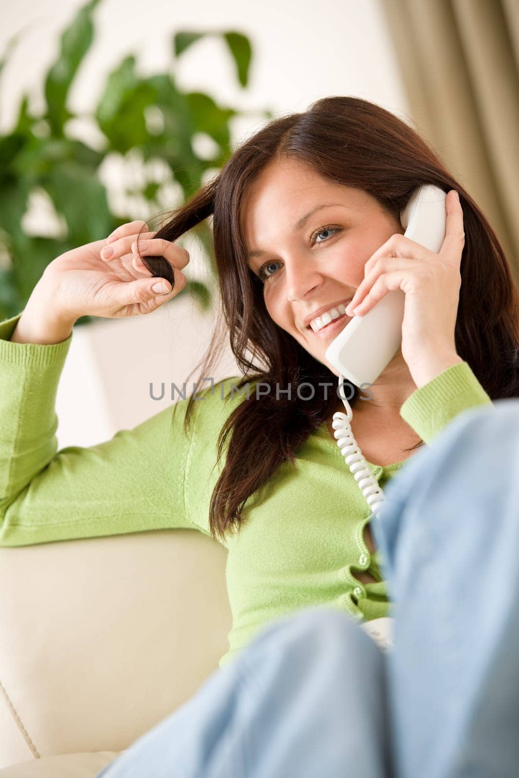 On the phone home Happy woman calling