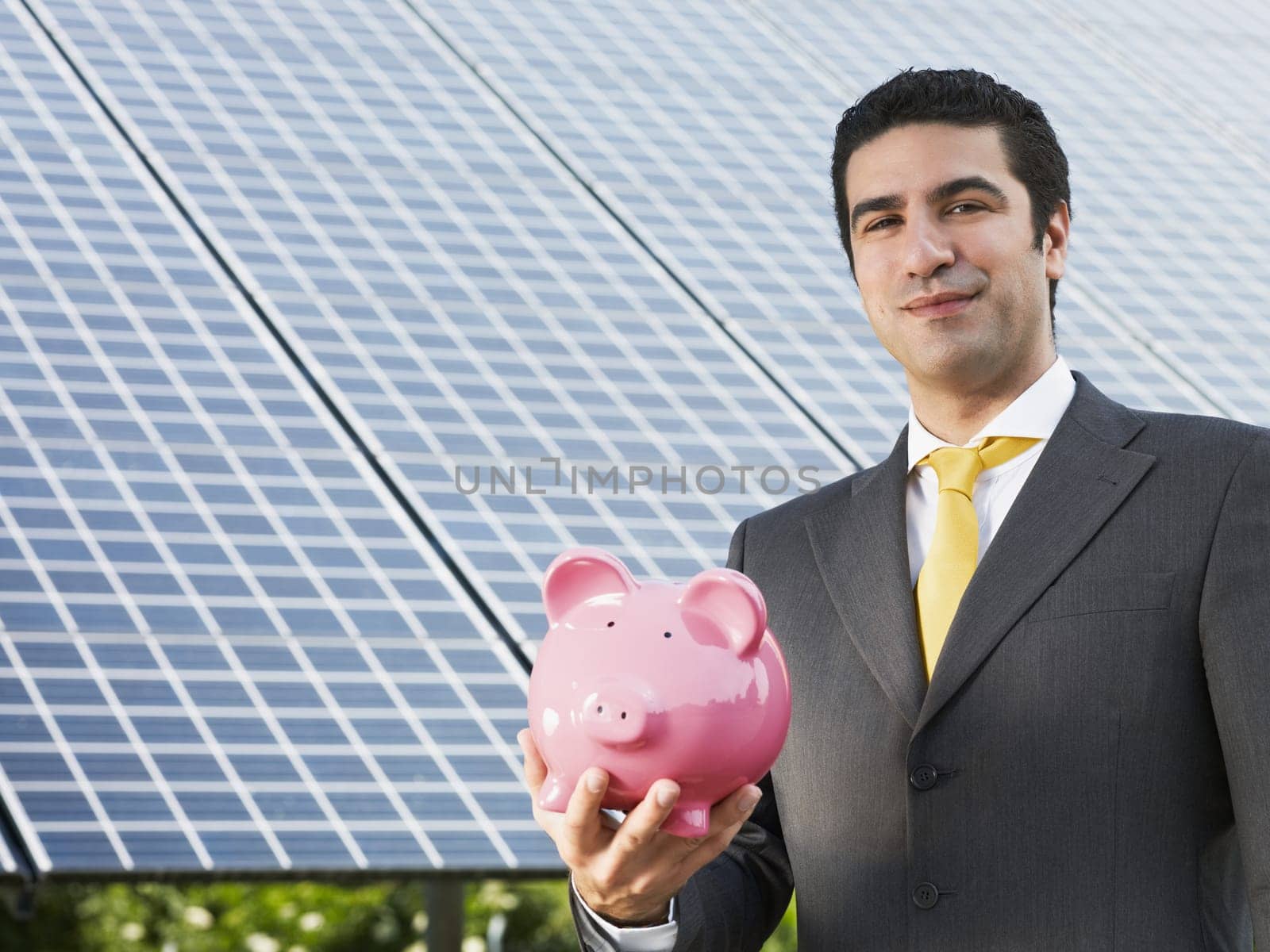 businessman and solar panels