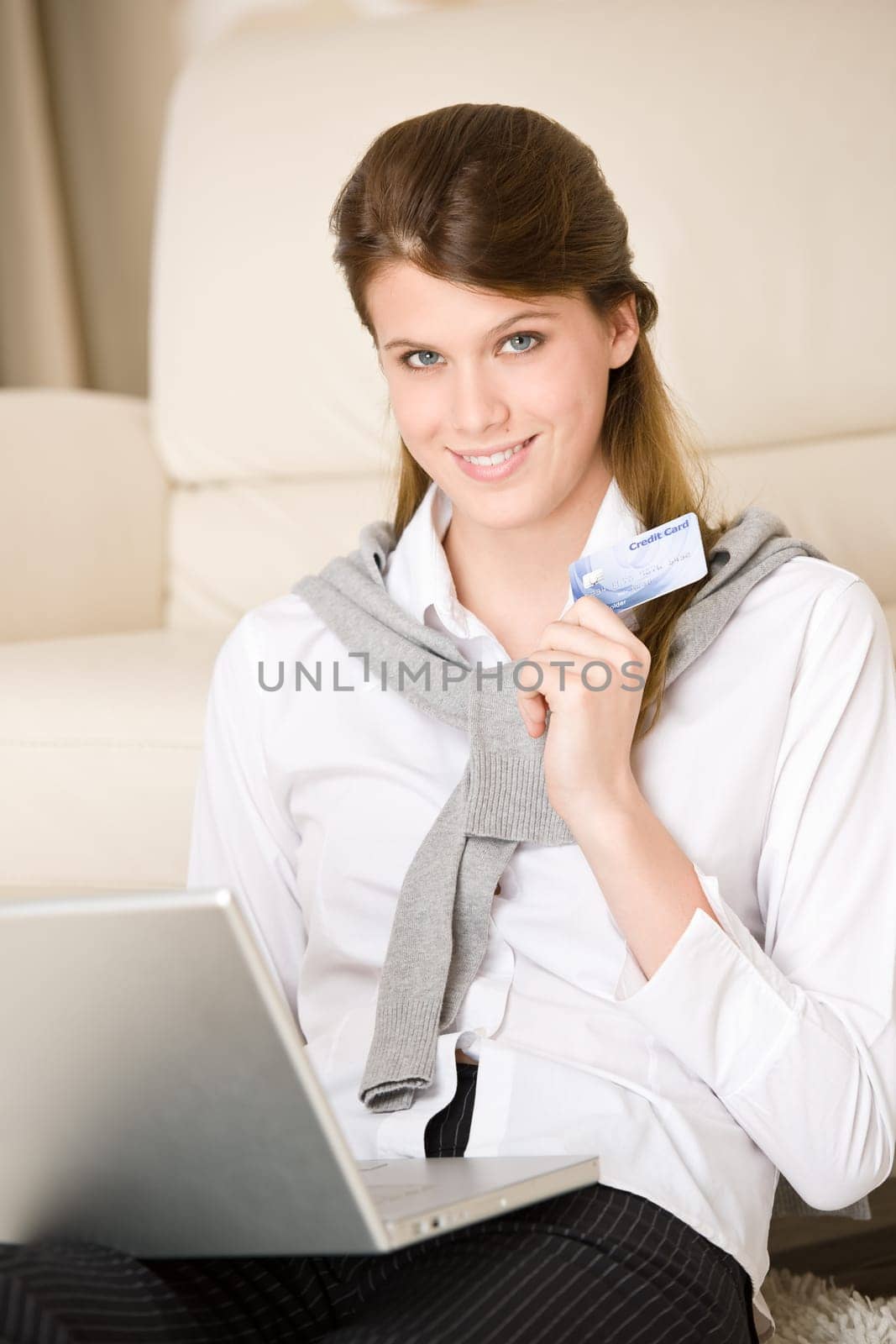 Home shopping - woman with credit card and laptop