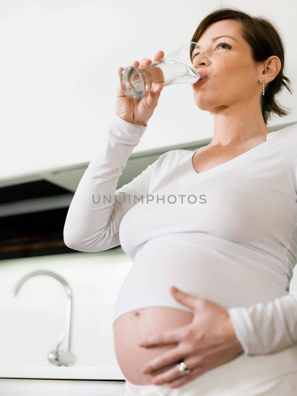 pregnant woman drinking water