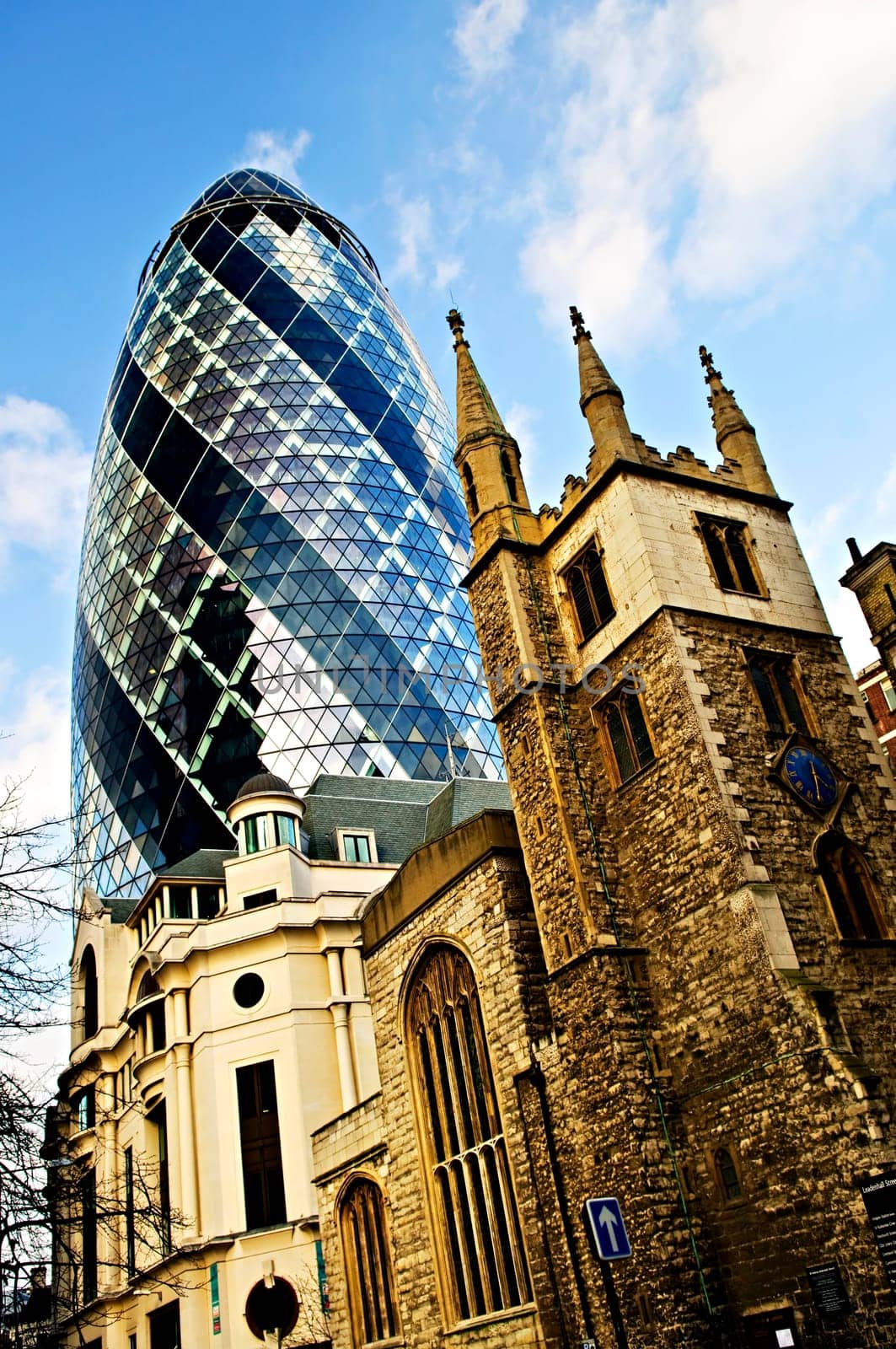 Gherkin building and church of St. Andrew Undershaft in London