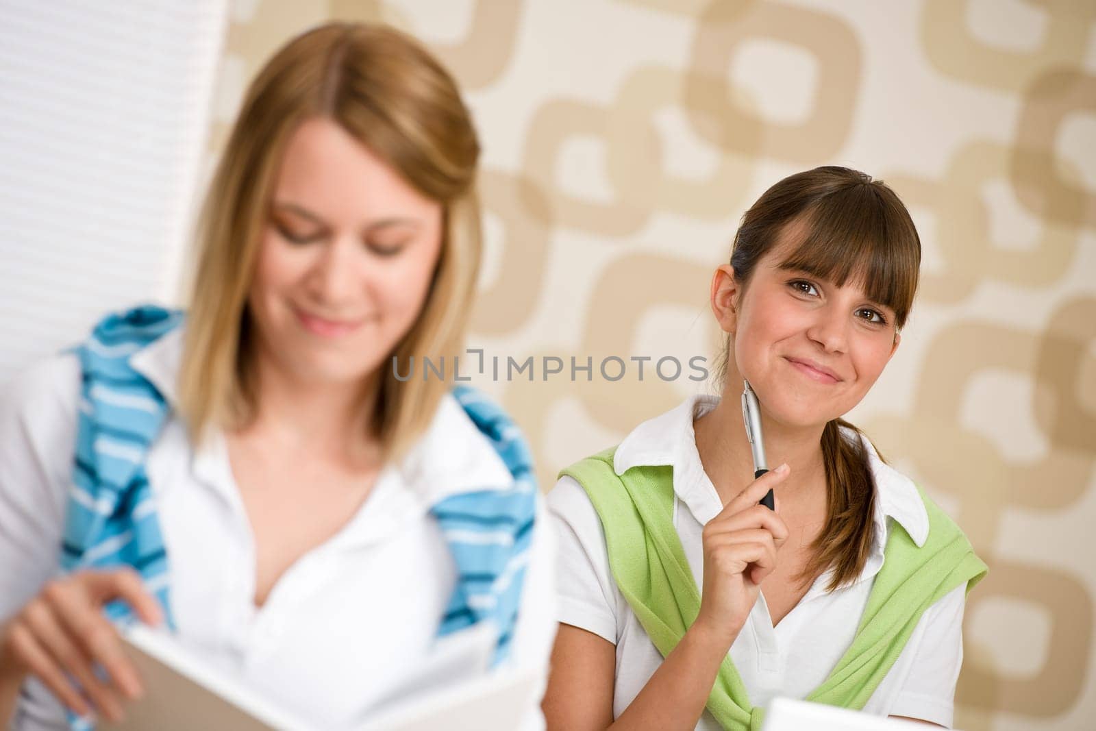 Student at home - two woman with book
