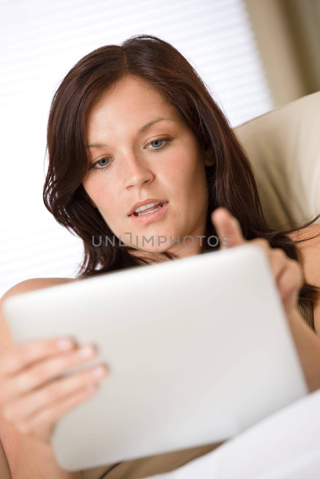 Young woman with touch screen tablet computer