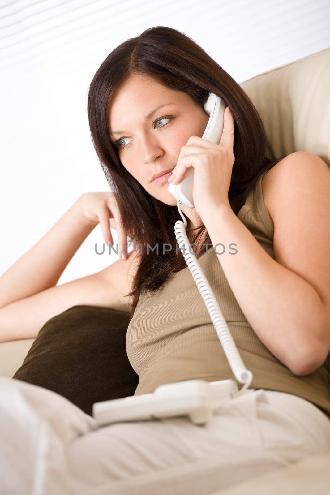 On the phone home - young woman calling
