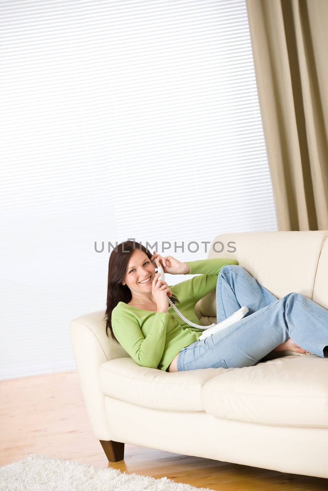 On the phone home smilling woman calling