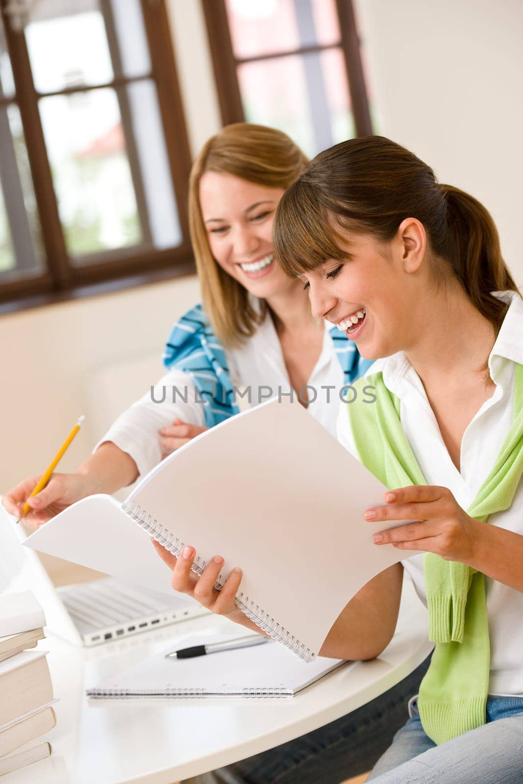 Student at home - two happy woman with laptop