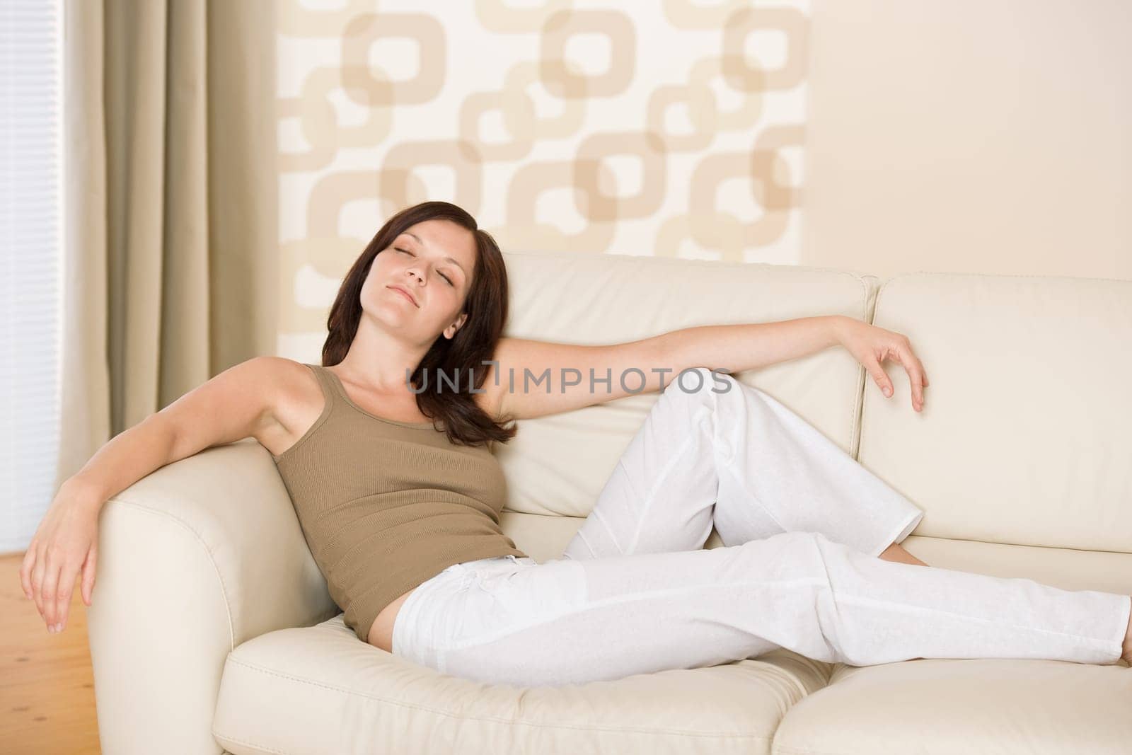 Young woman relaxing in lounge