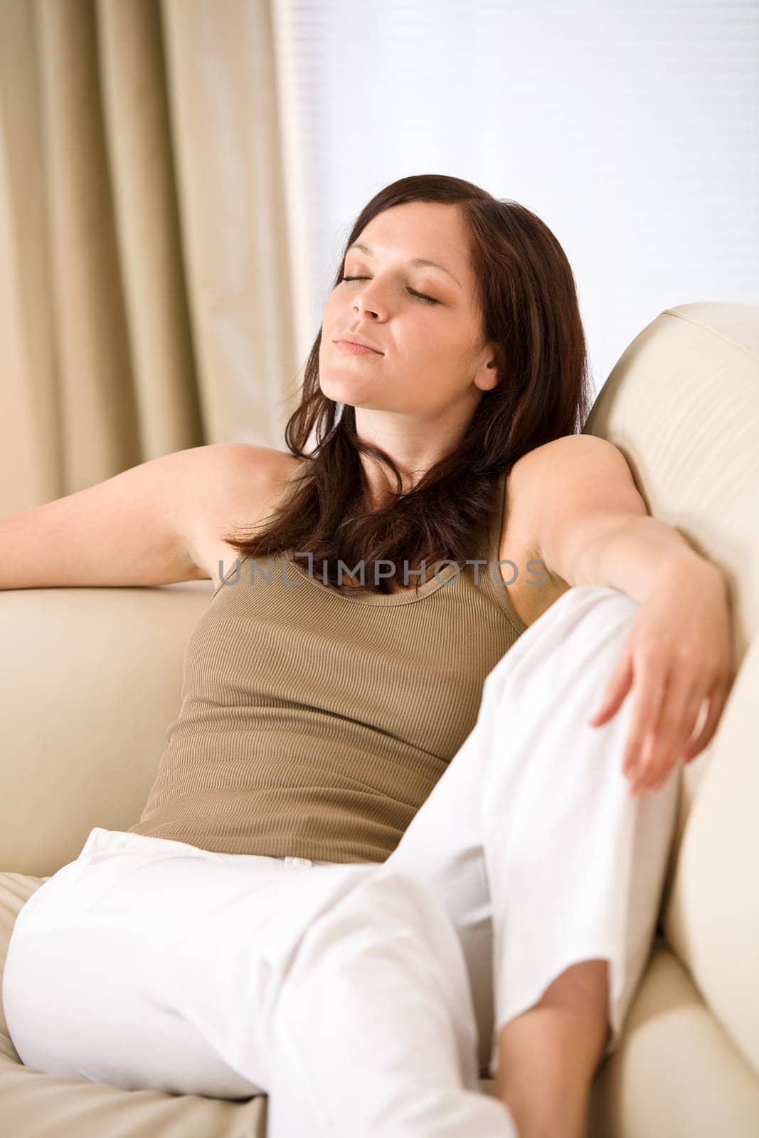 Young woman relaxing in lounge