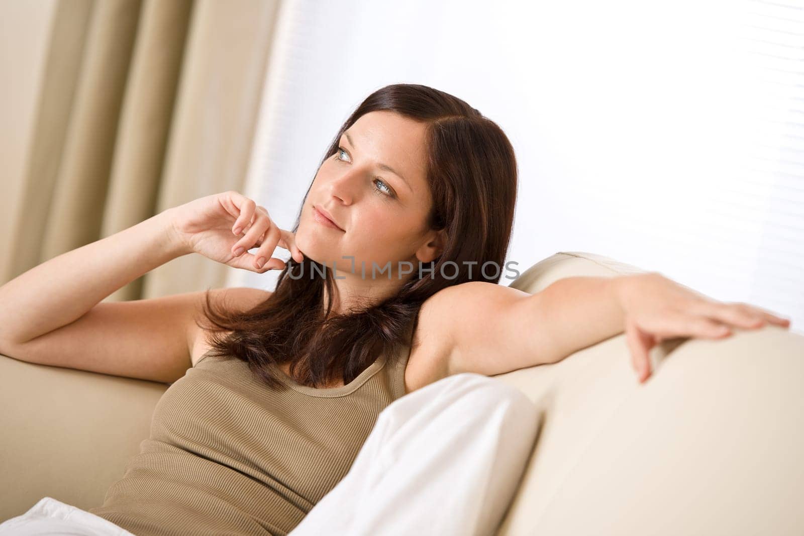 Young woman relaxing in lounge