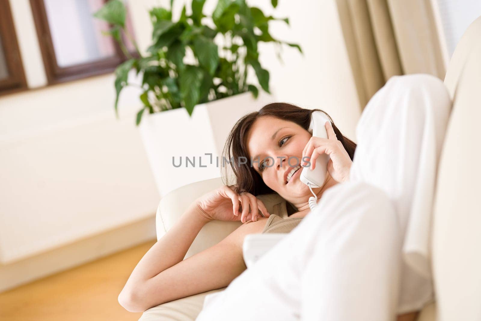 On the phone home - young woman calling