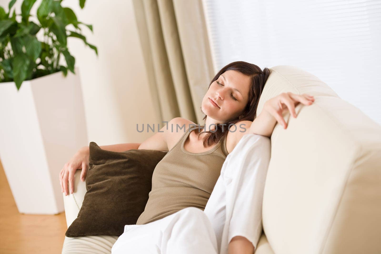 Young woman relaxing in lounge