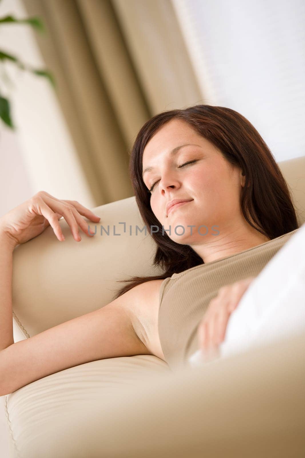Young woman relaxing in lounge