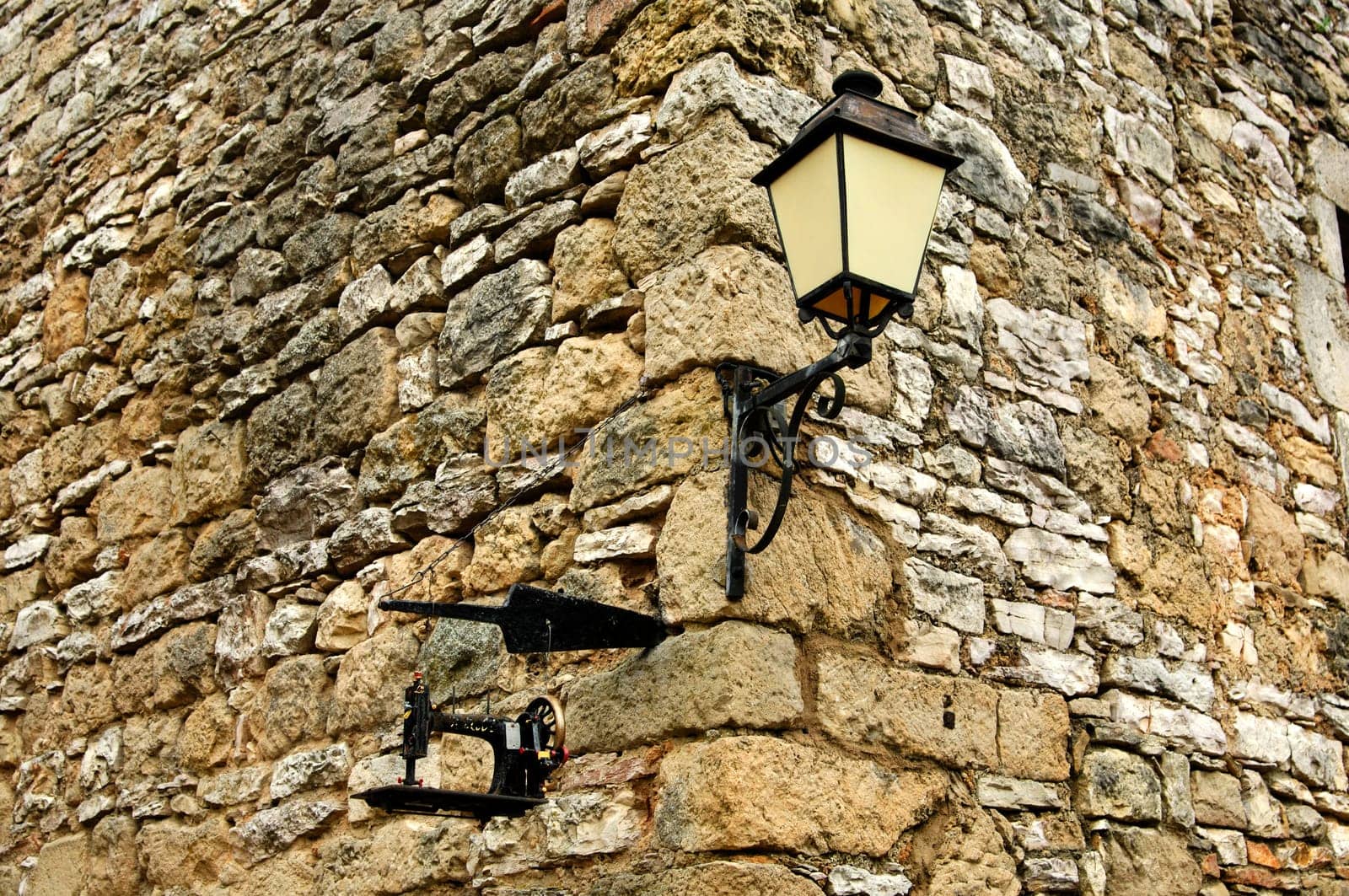 Masonry with lantern and sewing machine at the Maison de la Scipione,La Couvertoirade