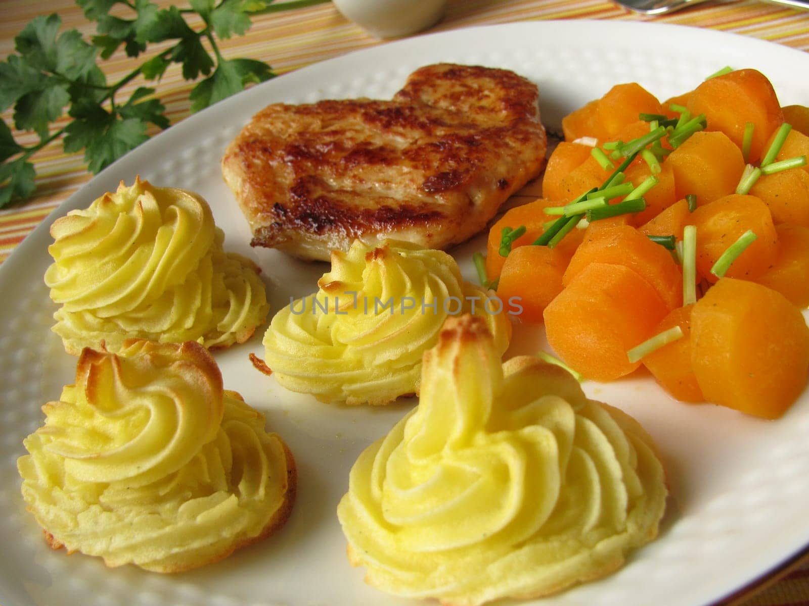 Chicken schnitzel with duchess potatoes