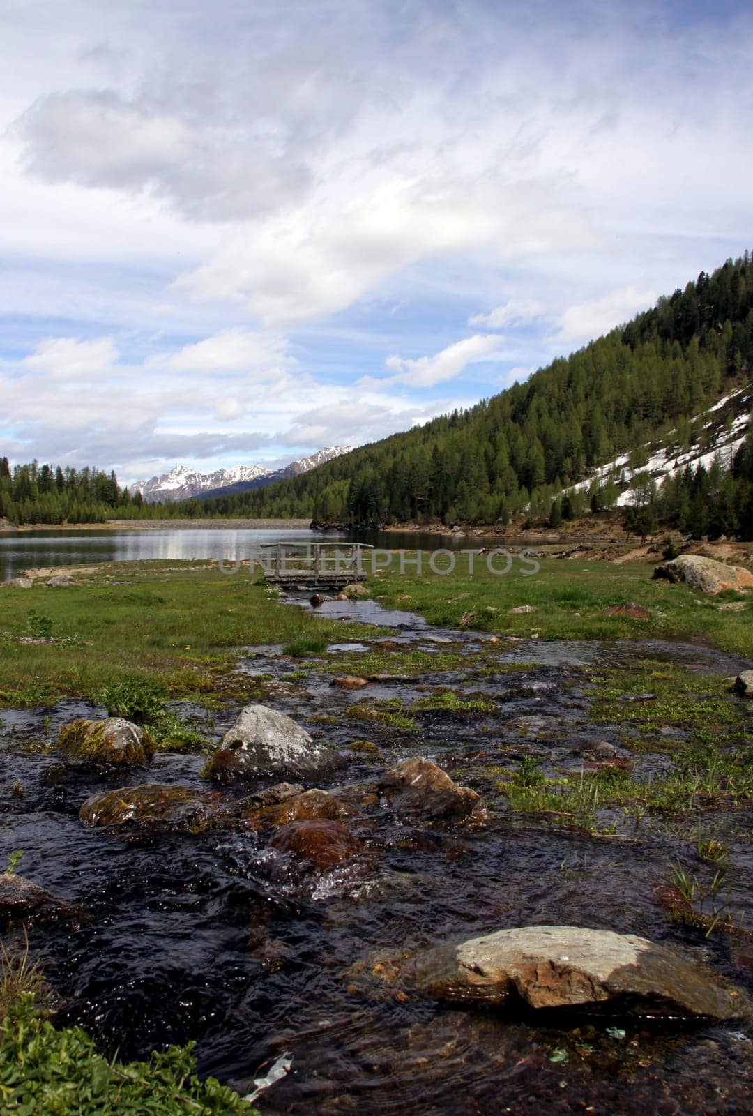 South Tyrol: Weißbrunnsee nature reserve in Val d'Ultimo near Merano The Weissbrunn reservoir is the source of the Falschauer River. This river runs through the Val d'Ultimo and flows into the Adige River near Lana.