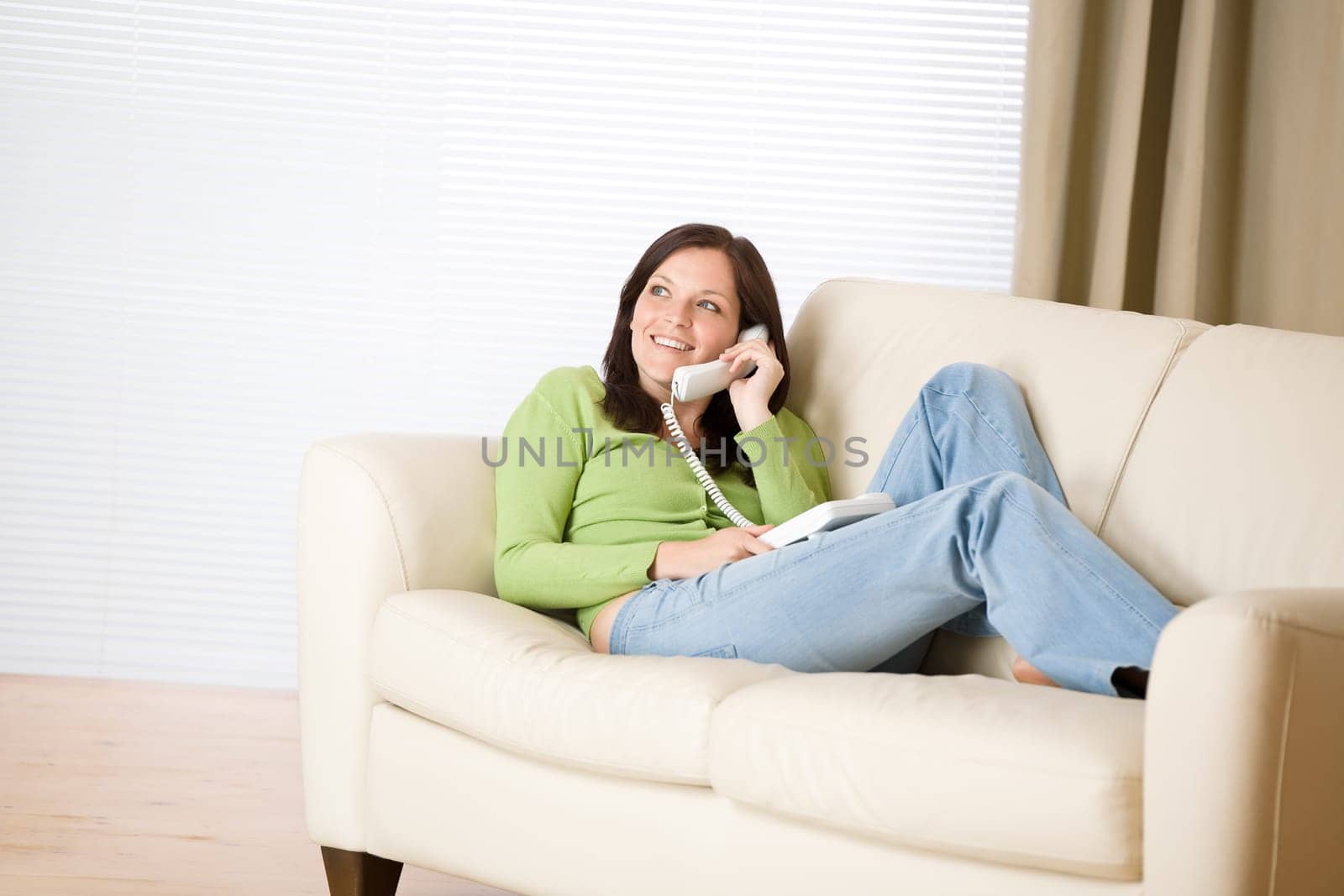 On the phone home - young woman calling