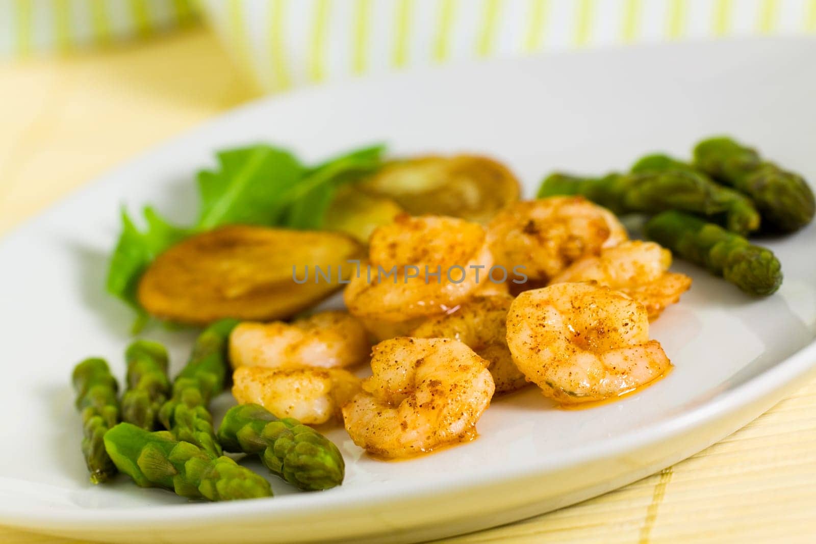 Prawns with baked potatoes,and green