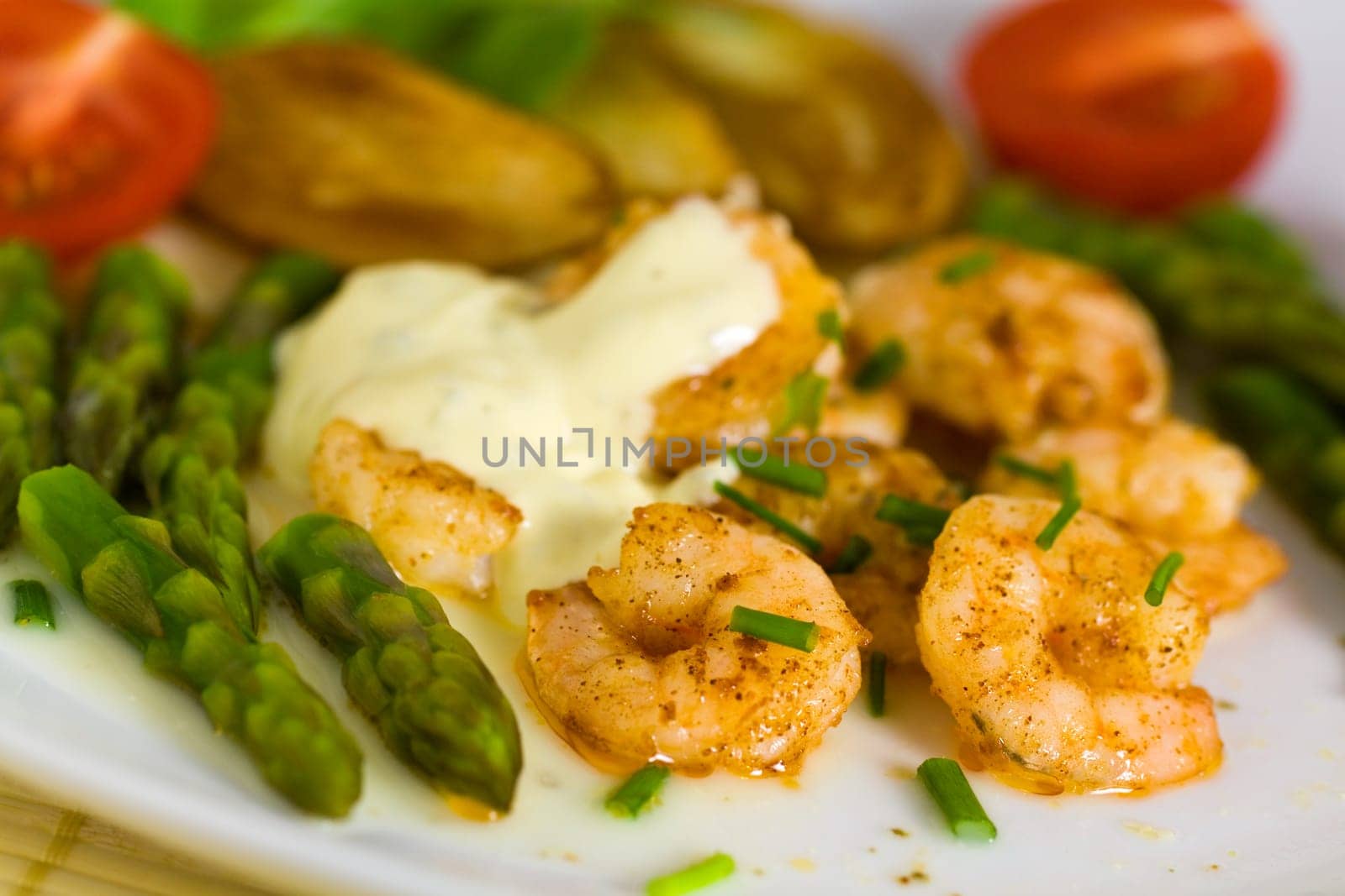 Prawns with baked potatoes,and green