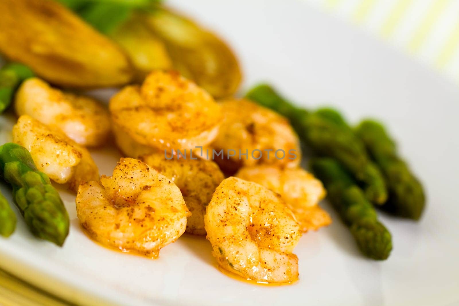 Prawns with baked potatoes,and green