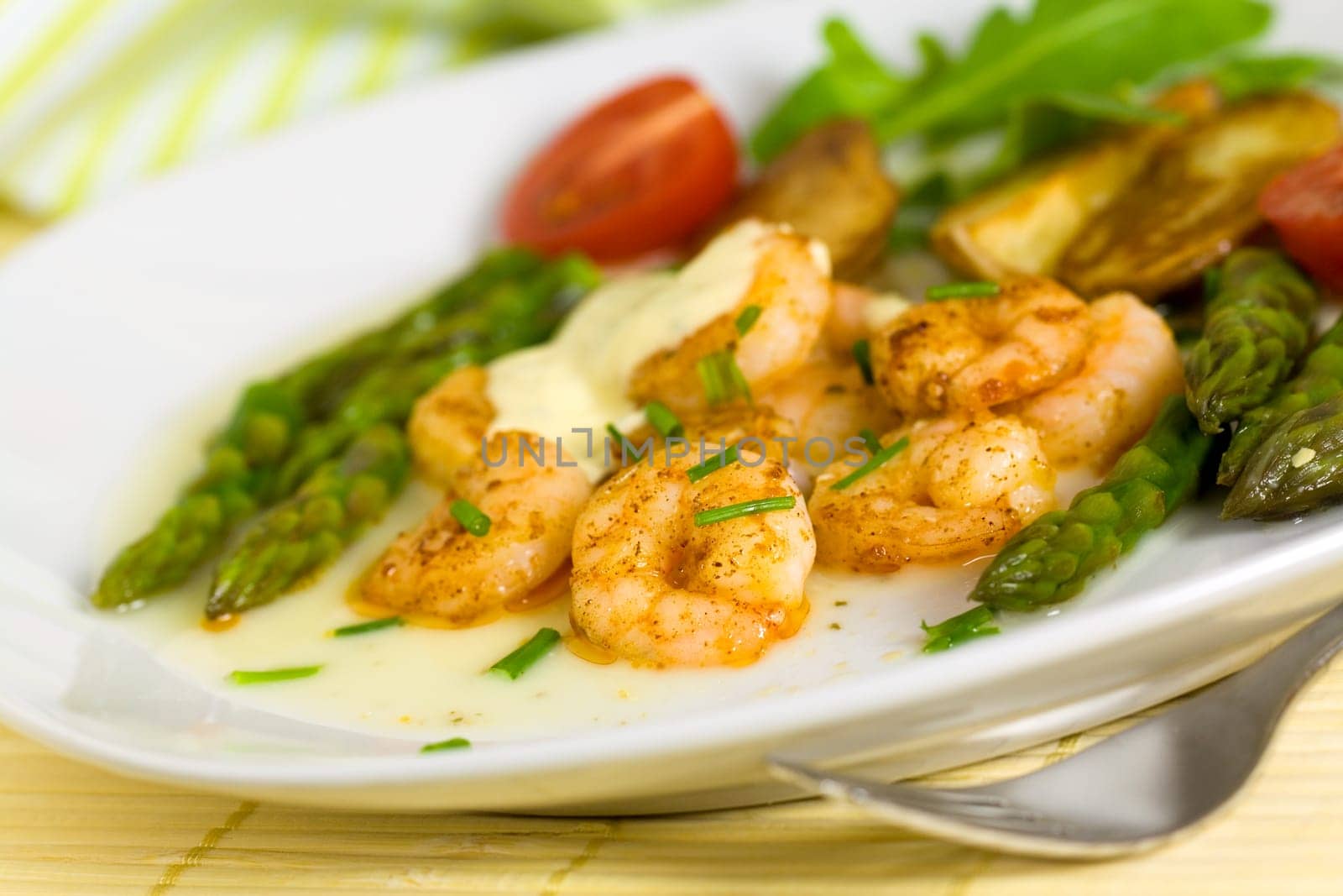 Prawns with baked potatoes,and green