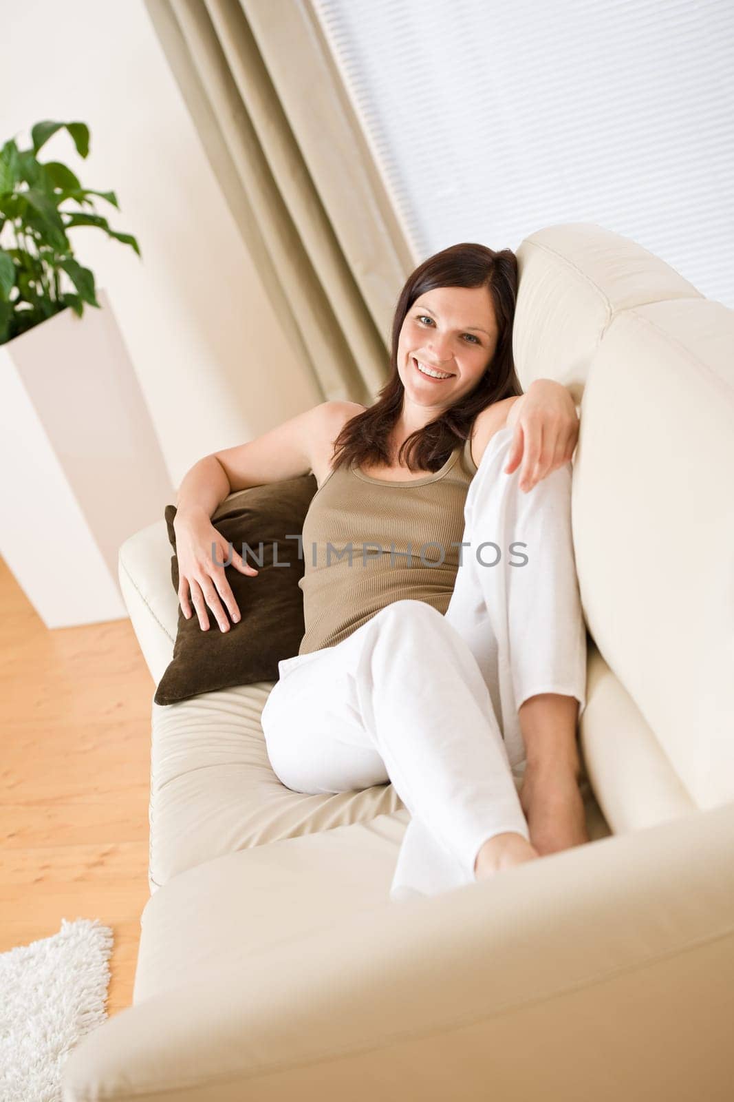 Young woman relax lying down in lounge