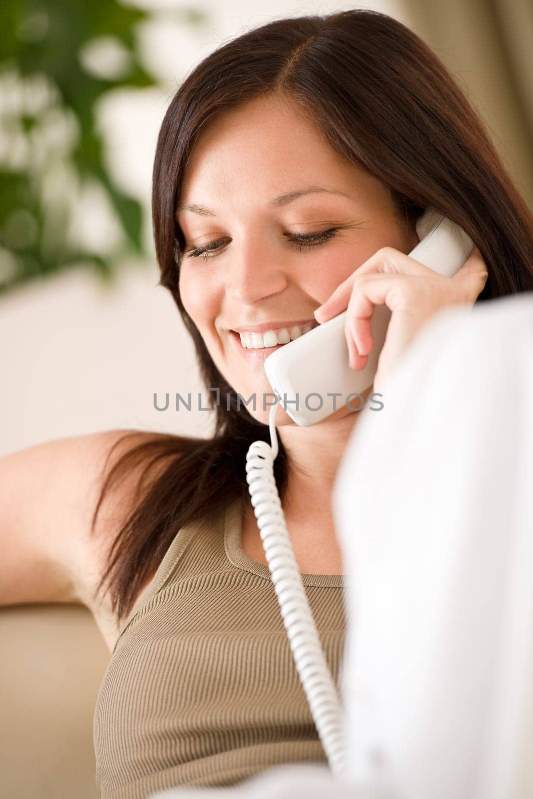 On the phone home - young woman calling