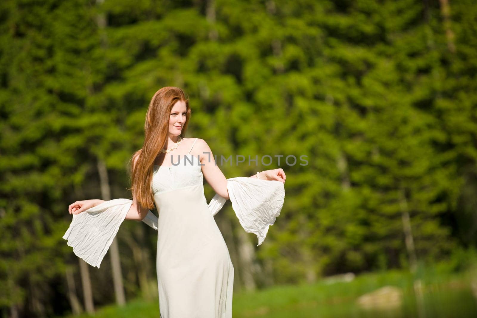 Beautiful romantic woman in summer sunny nature