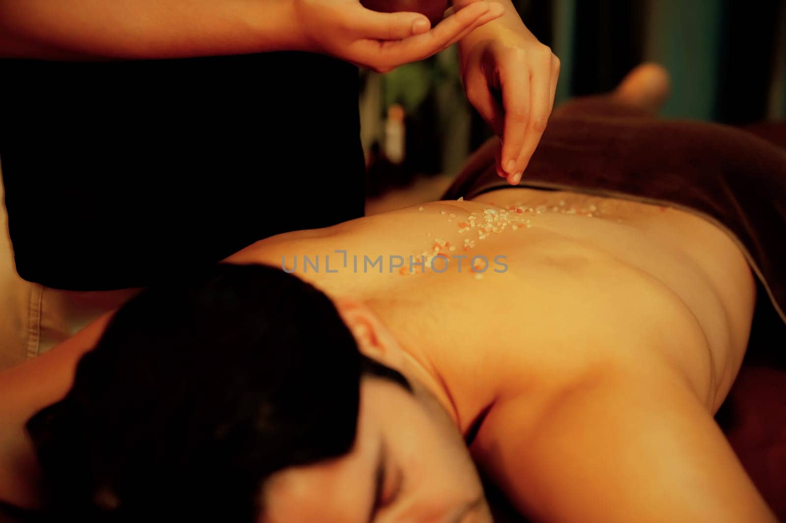 Man customer having exfoliation treatment in luxury spa. Quiescent by biancoblue