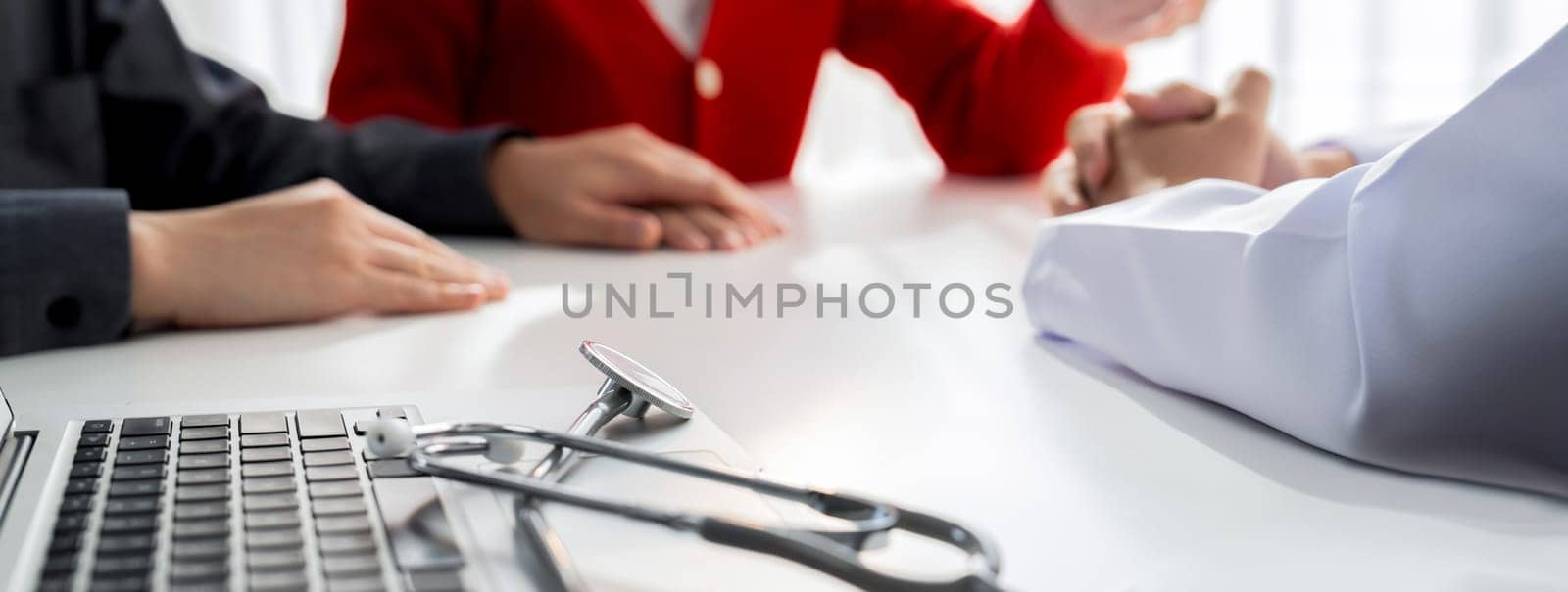 Couple attend fertility or medical consultation with gynecologist at hospital as family planning care for pregnancy. Husband and wife consoling each other through doctor appointment. Panorama Rigid