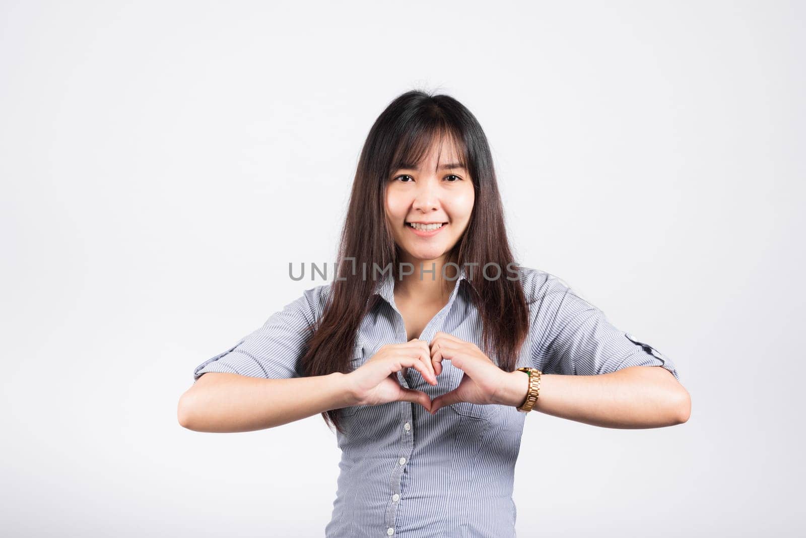 Woman smiling confidence make finger heart gesture figure symbol shape sign by Sorapop