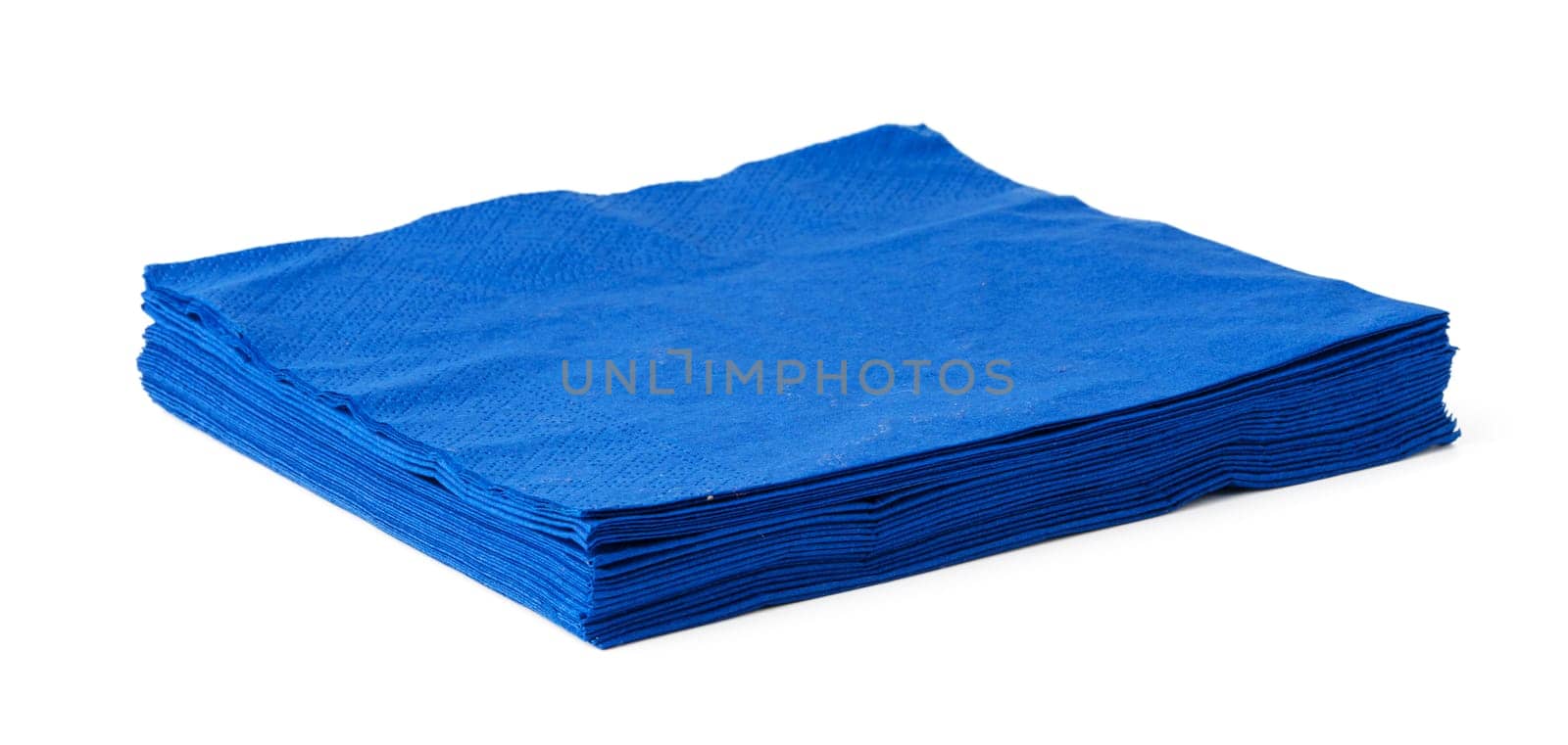 Stack of blue paper napkins on white background close up