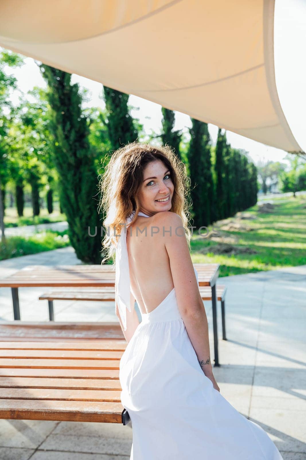 woman's walk in the park on the street in the summer