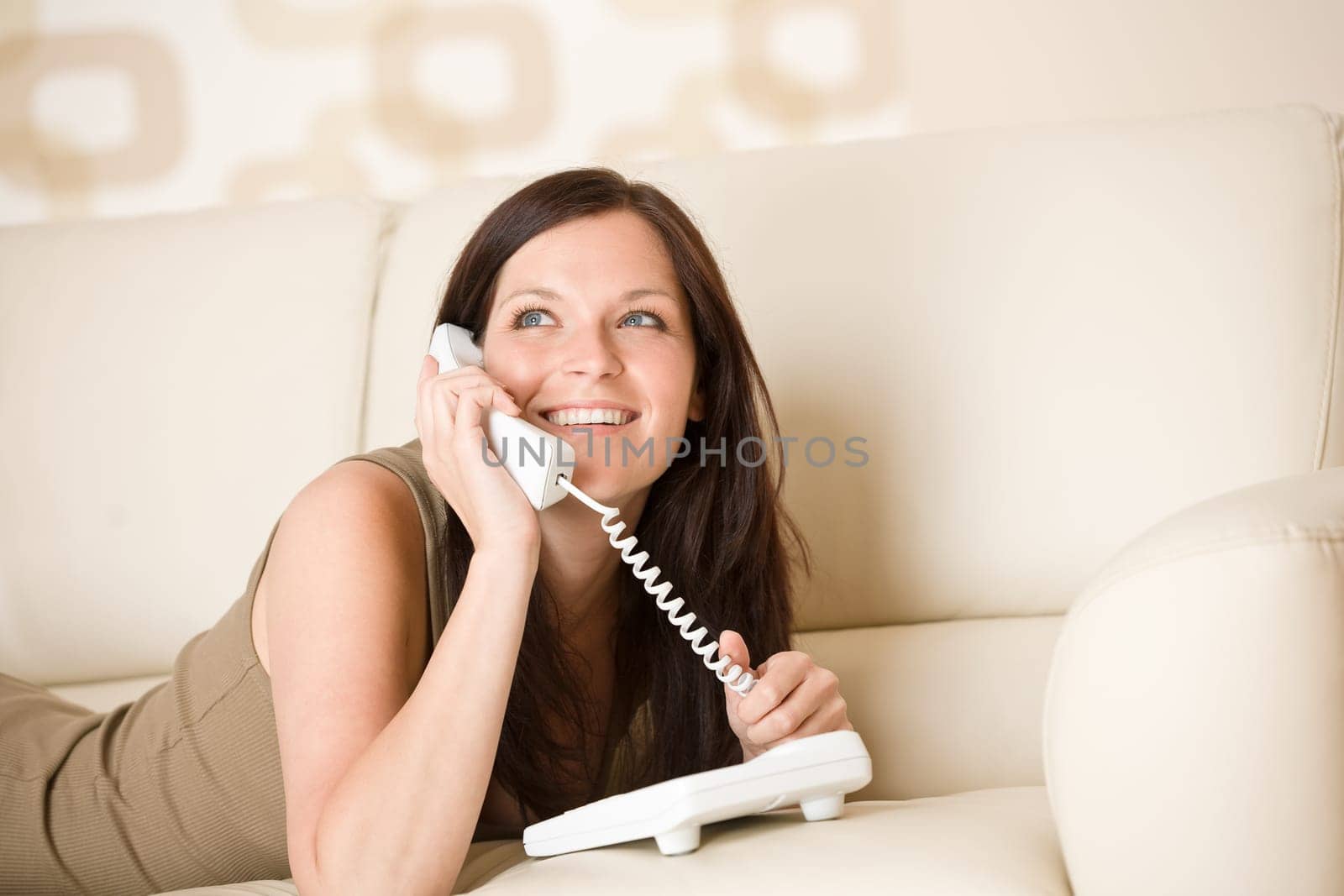 On the phone home - young woman calling