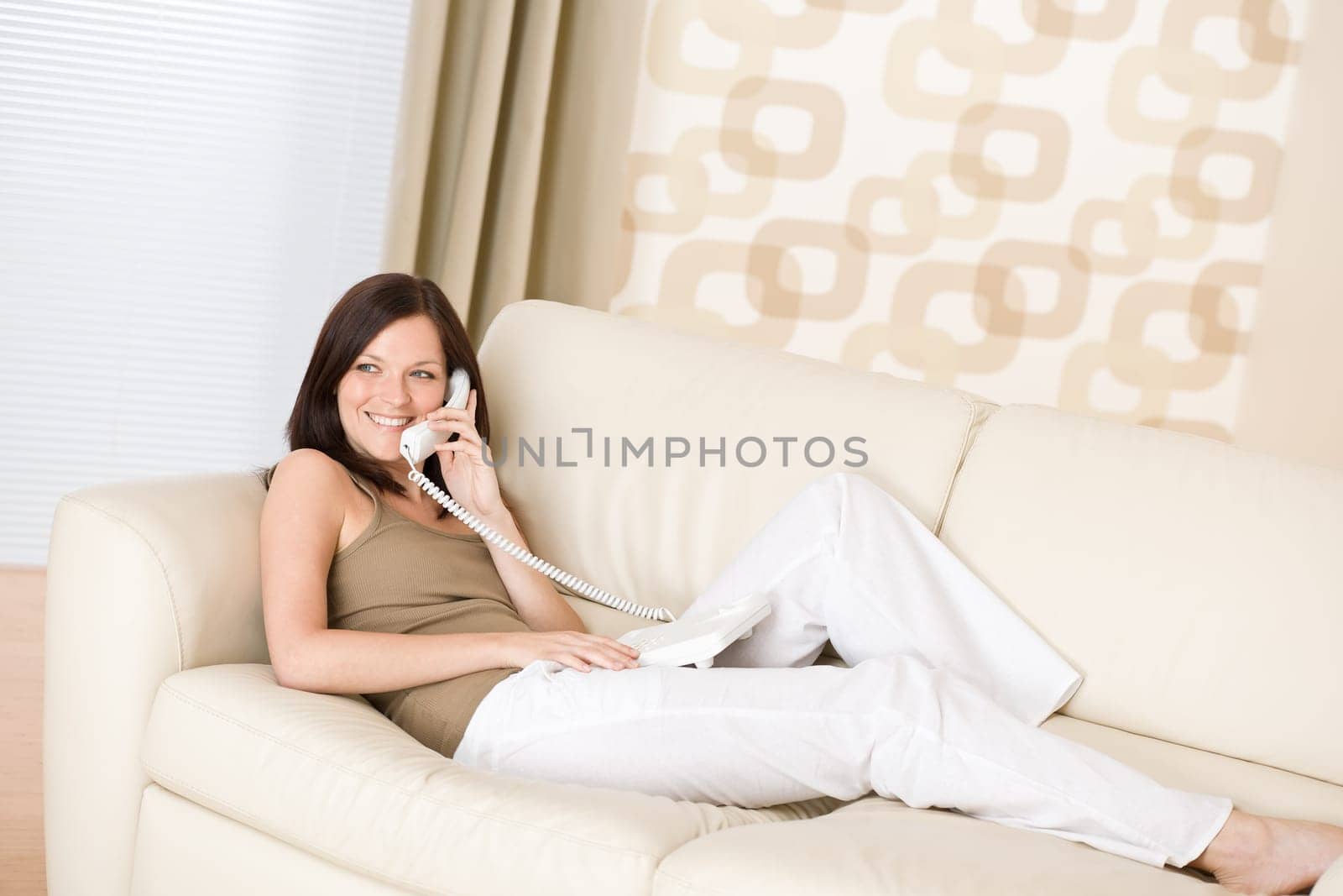 On the phone home - young woman calling