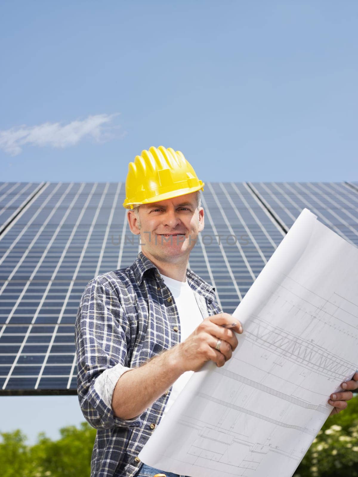 businessman and solar panels