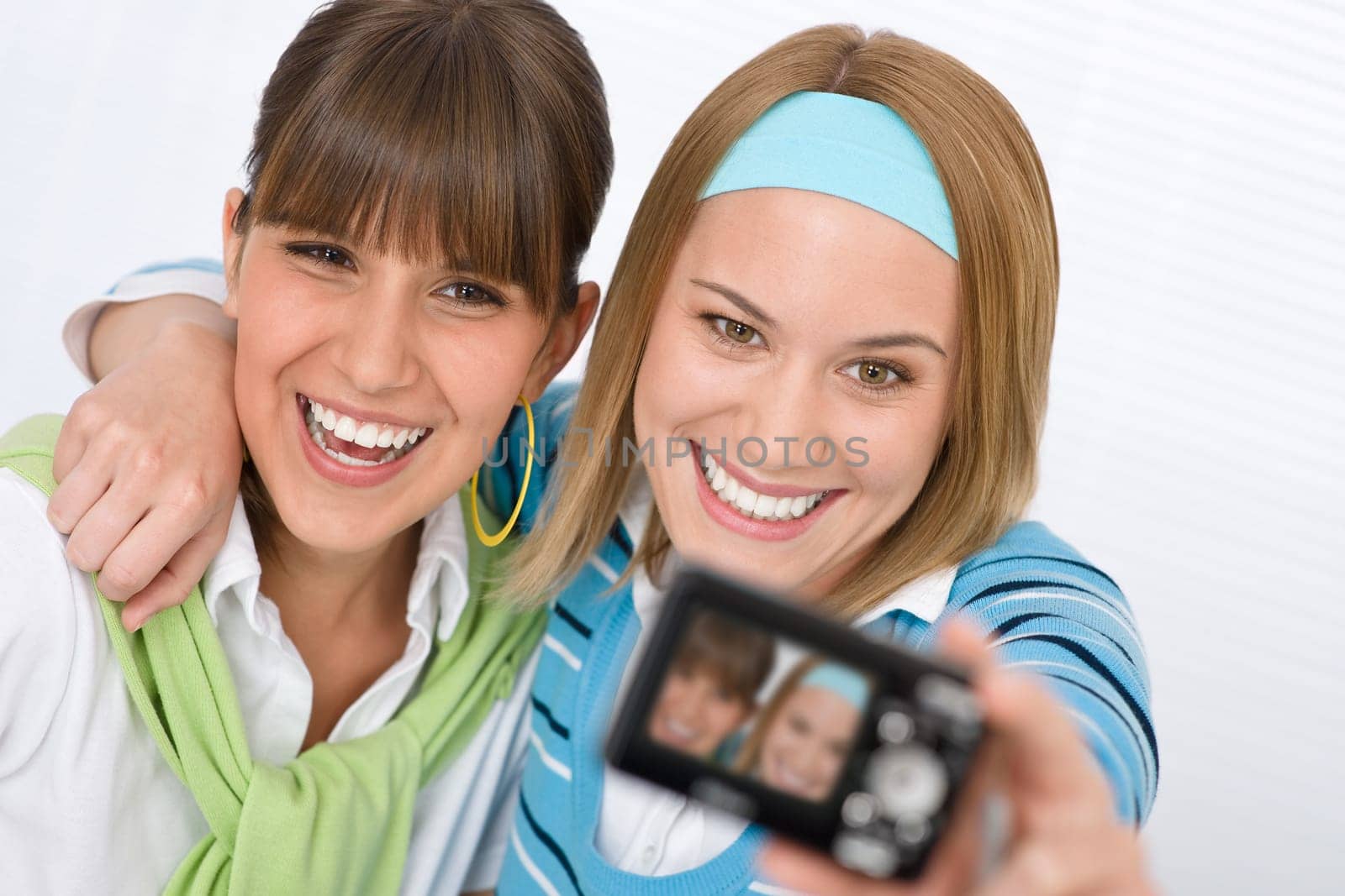 Student at home - two young woman study together