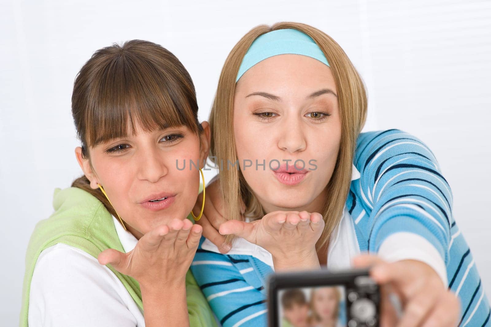 Student at home - two young woman study together