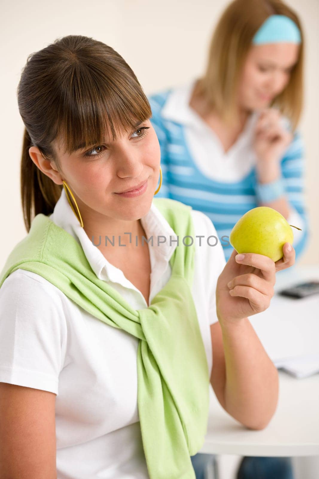 Student at home - happy woman with apple