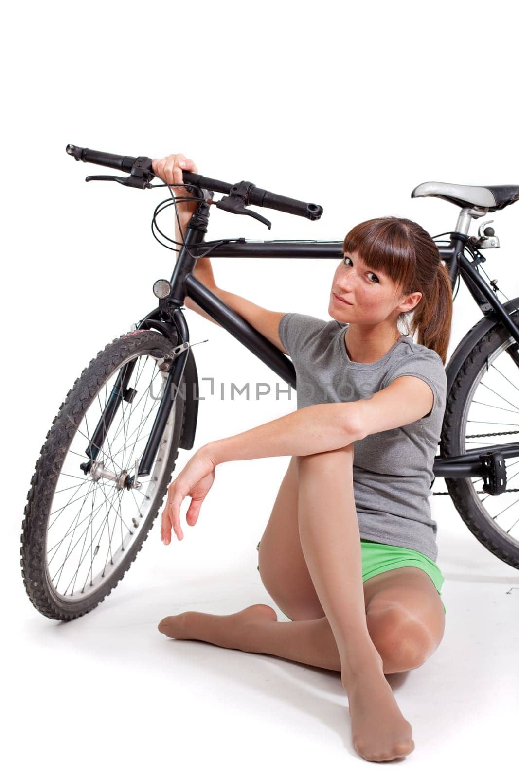women with bicycle in studio