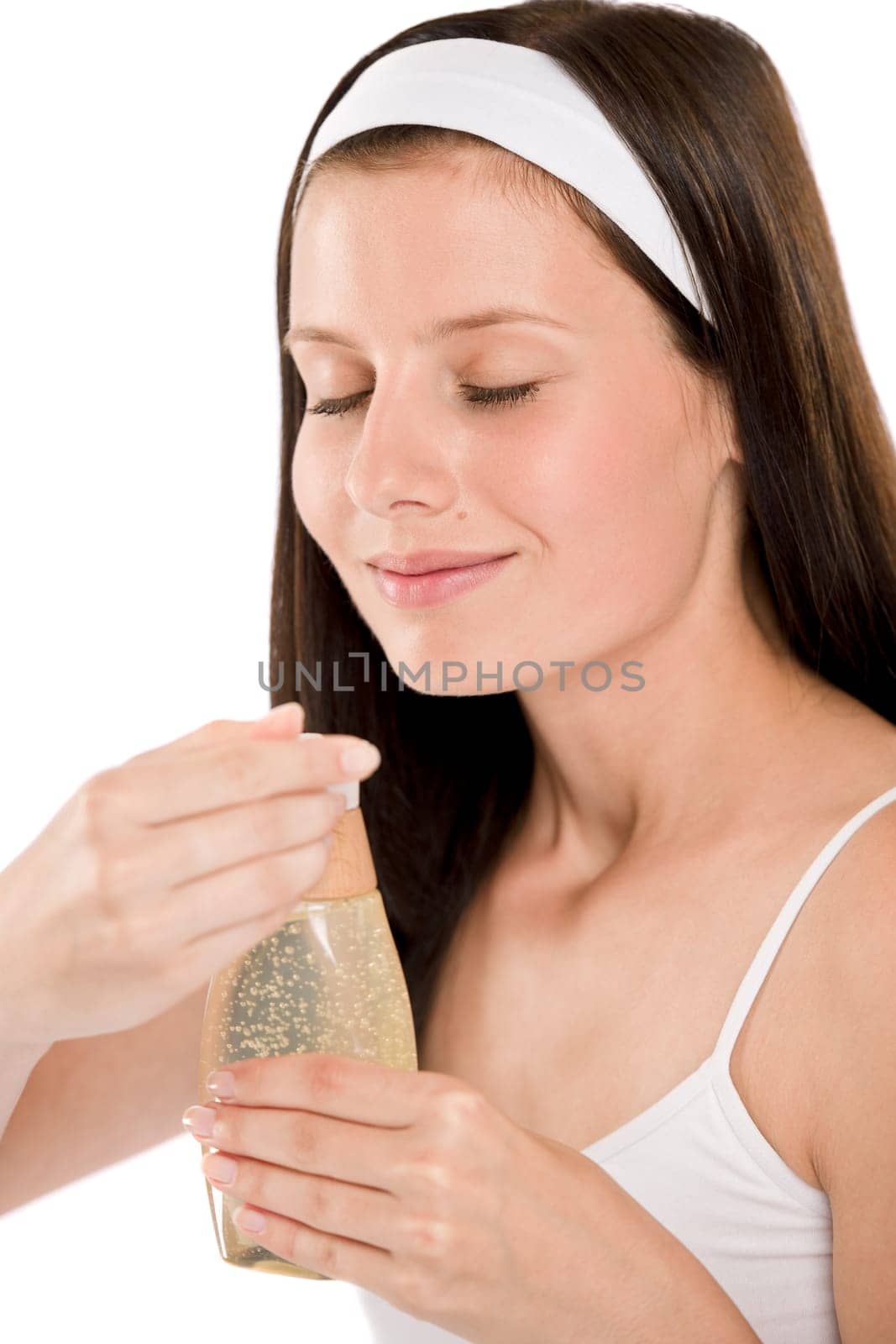 Body care - woman smelling shampoo